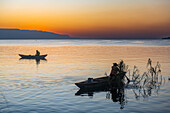 Fisherman at sunset in Mpulungu, Lake Tanganyika, Zambia, Africa