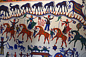 Rathwa tribal man's house wall painted in the Pithora style emanating from local cave paintings in Koraj-i-Dungar, Gujarat, India, Asia