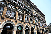 Elphinstone Building, built 1870, styled on a Venetian Gothic Palazzo, now houses a Tata Alliance Starbucks coffee shop, Mumbai, India, Asia