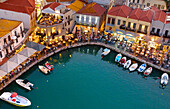 Old Venetian harbour and restaurants at dusk, Rethymno, Crete, Greek Islands, Greece, Europe