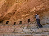 Photographing at the Puebloan granaries at Upper Nankoweap, Grand Canyon National Park, Arizona, United States of America, North America