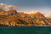 View of Castelmola, Taormina and Giardini Naxos viewed from Giardini Naxos beach, Sicily, Italy, Mediterranean, Europe