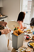 Family cleaning after having dinner