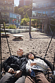 Friends relaxing on swing