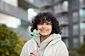 Portrait of teenage girl holding pinwheel