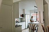 Woman standing in modern kitchen