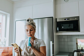 Smiling woman in kitchen