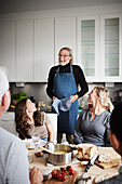 Man serving food to family