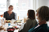 Family eating dinner at home together