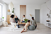 Family relaxing and playing games at home