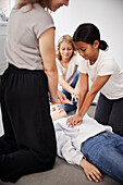 Teacher giving first aid training