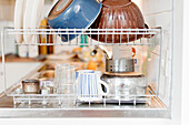 Pots and pans on dish rack