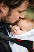 Father kissing baby