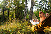 Woman relaxing on hammock