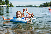 Happy girl on inflatable raft