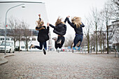 Girls jumping together