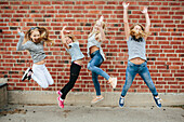 Happy girls jumping