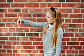 Girl with cell phone taking selfie