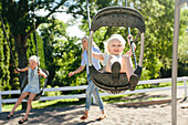 Happy girl swinging