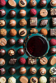 Red wine and various chocolate truffles and sweets
