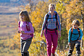 Mother hiking with children