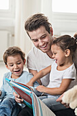 Male preschool read story in preschool