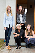 Senior woman with three adult granddaughters