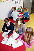 Teenagers learning by table