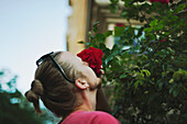 Man smelling rose