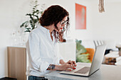 Young woman using laptop