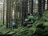 Couple relaxing in forest