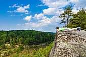 Boy relaxing on rock