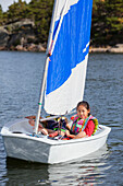 Girl in sailing boat.