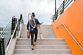 Man carrying bicycle on steps