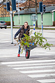 Woman pushing wheelbarrow