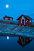 Wooden house on rocky coast