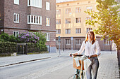 Woman walking with bicycle