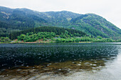 Lake in mountains during rain