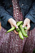 Girl holding green beans