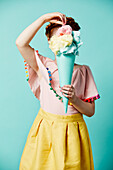 Girl holding toy ice-cream cone