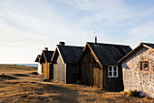 Houses and barns near sea coast