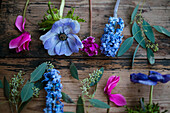 Colorful flowers on wooden plank