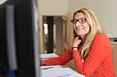 Blond woman working in office