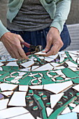 Woman making mosaic