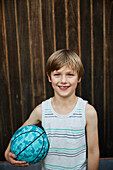 Portrait of boy holding ball