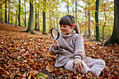 Girl with magnifying glass