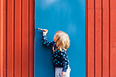 Girl opening door