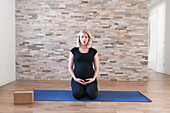 Pregnant woman practicing yoga