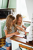 Two girls with notebook