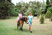 Girl horseback riding